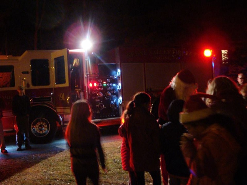 Fire Fighters bring Santa to The Neighborhood House