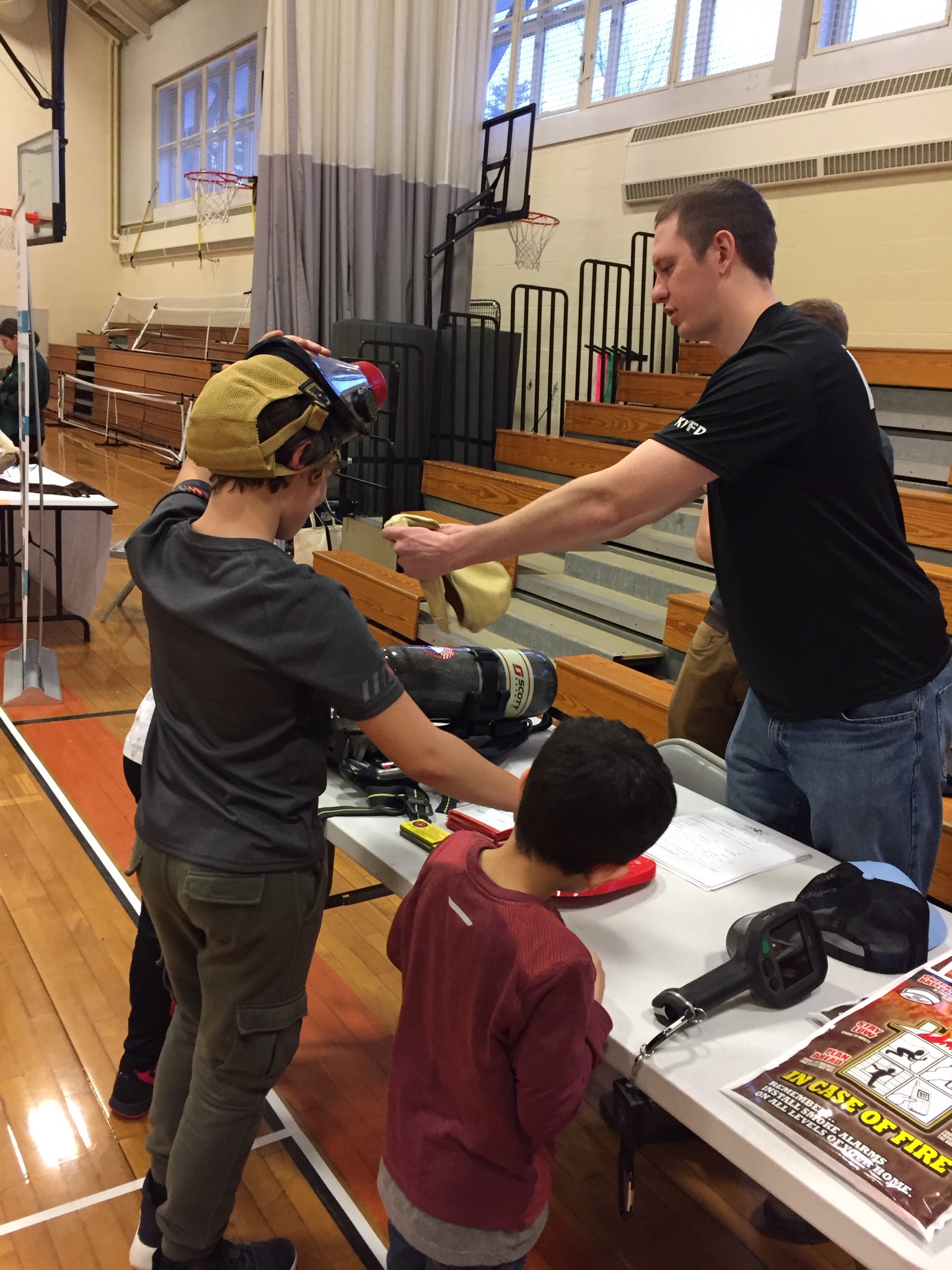 Members participate in the local school's Science Slam Event