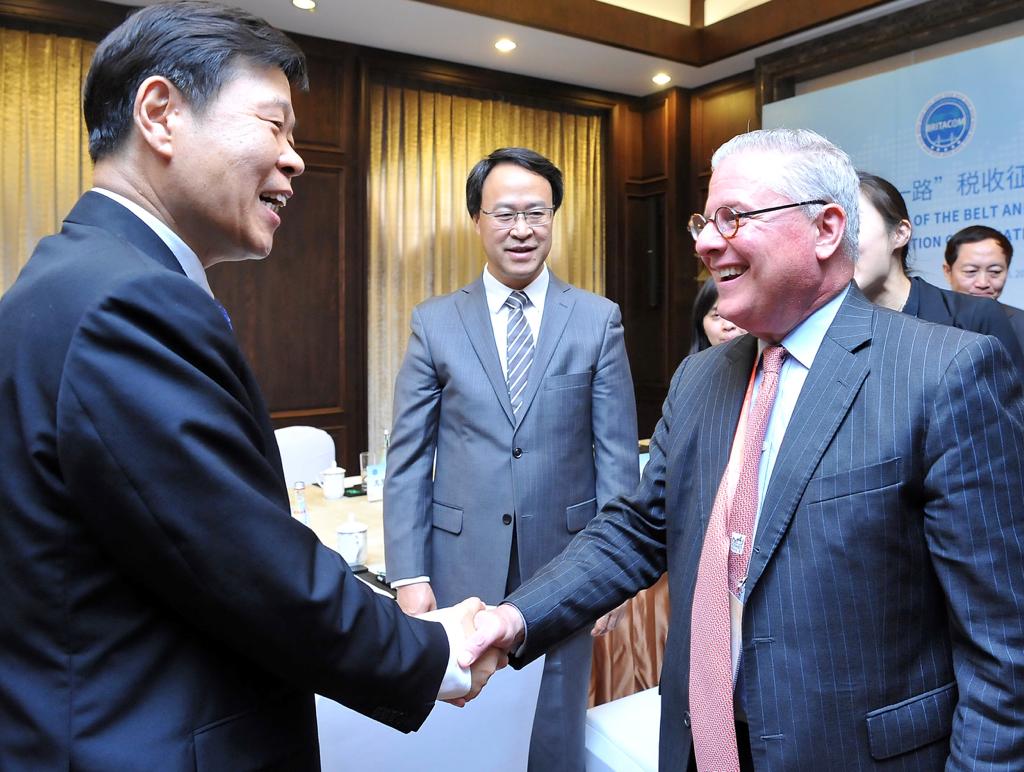 L to R: Wang Jun (STA Commissioner); Liao Tizhong (Director General of the STA International Department) and Dan Witt during the MoU signing ceremony.