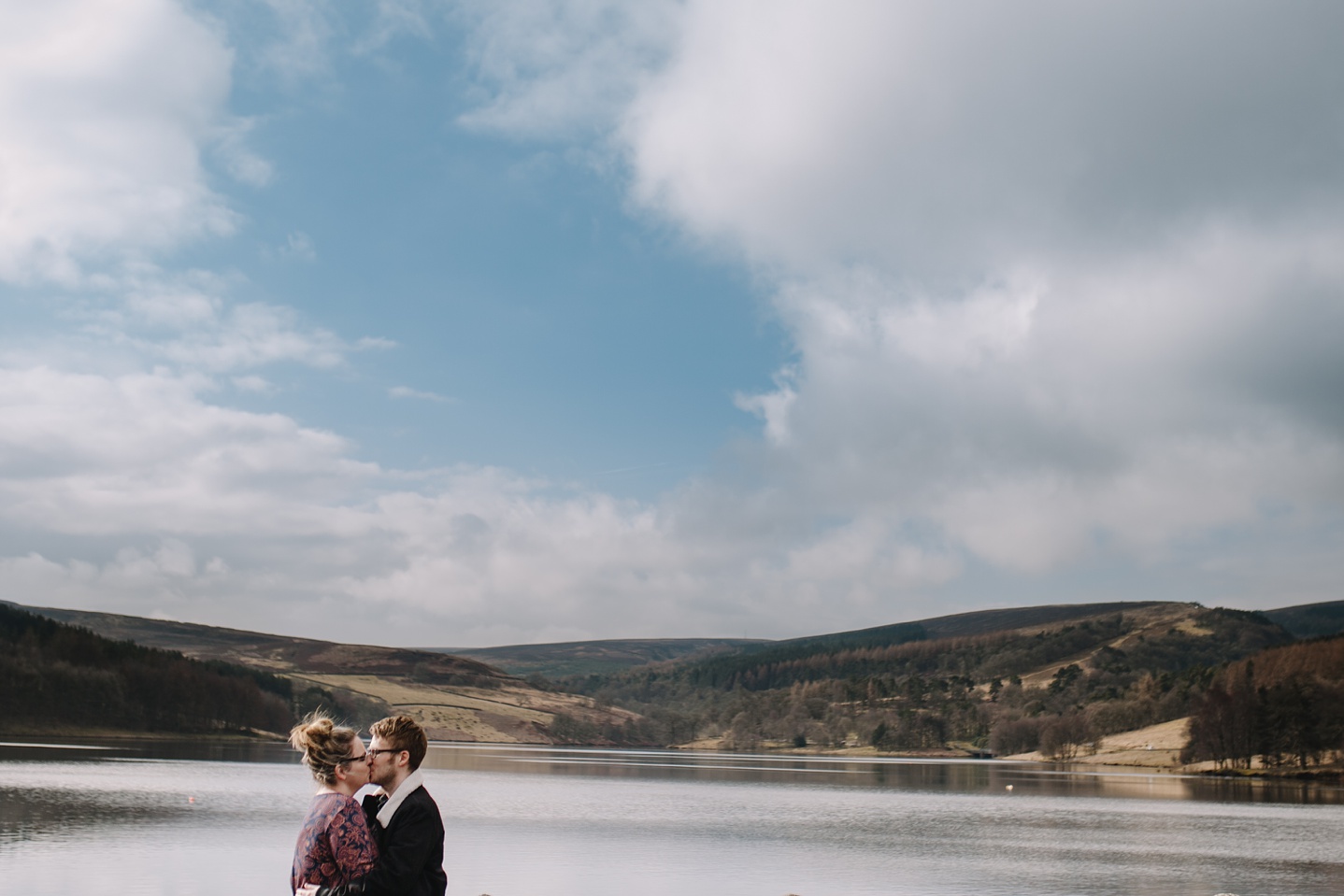 man and woman laughing with Eerwood reservoir in the background