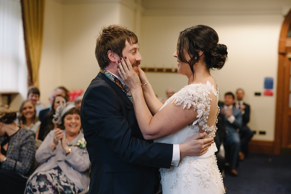 bride and groom laughing and smiling after first kiss at Sheffield Town Hall