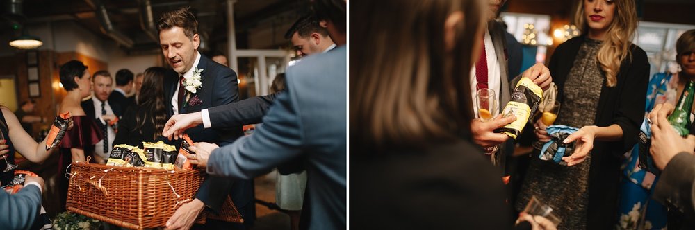 man handing out Yorkshire crisps as wedding favours