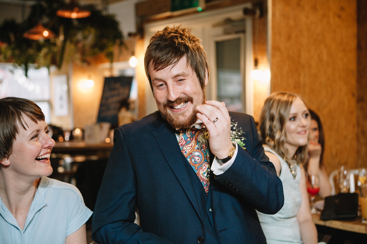 groom laughing at speeches