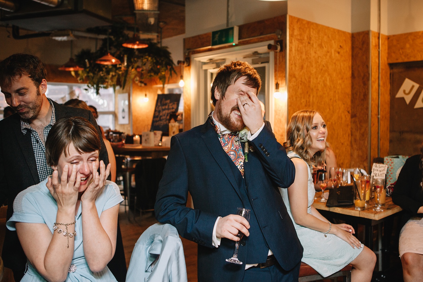 groom embarrassed laughing at speeches