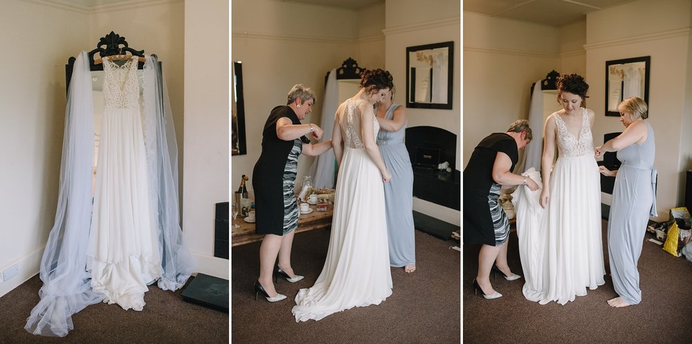 bride getting ready into her wedding dress at Whirlowbrook Hall