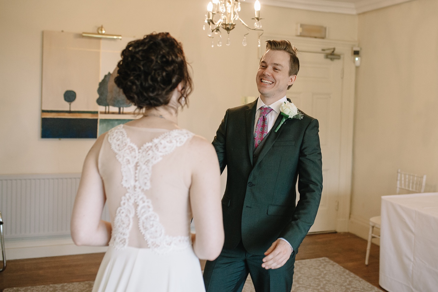 bride smiling at seeing his bride for the first time