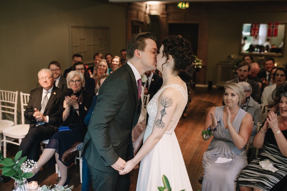 first kiss of bride and groom at Whirlowbrook Hall wedding