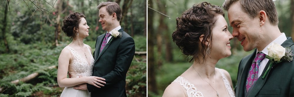 bride and groom smiling in the woods