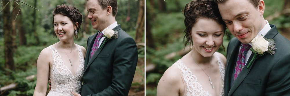 bride and groom laughing and smiling in the woods