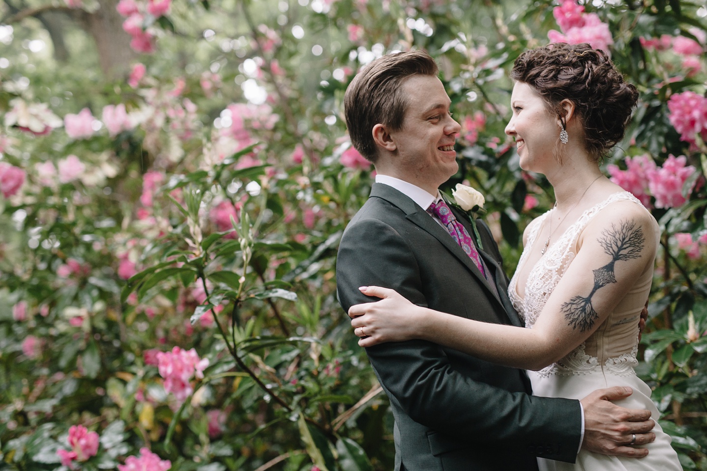 bride and groom hugging in woods at Whirlowbrook Hall wedding