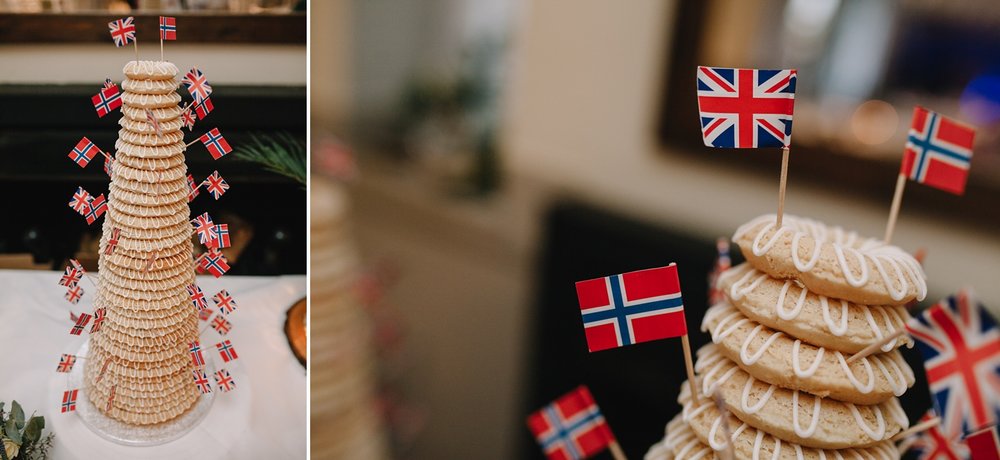 close up if traditional danish kransekake cake with little United Kingdom and Danish flags on