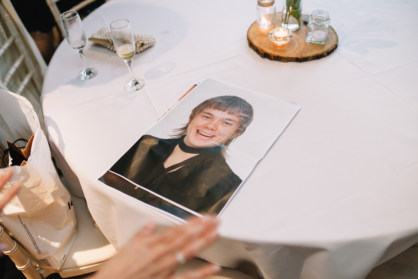 close up of embarrassing photo of groom