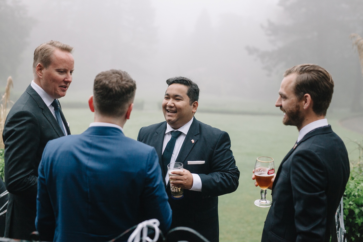 guests laughing in the gardens of Whirlowbrook Hall