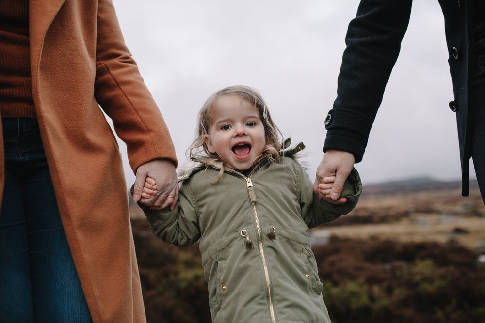 fun family photography of a little girl smiling