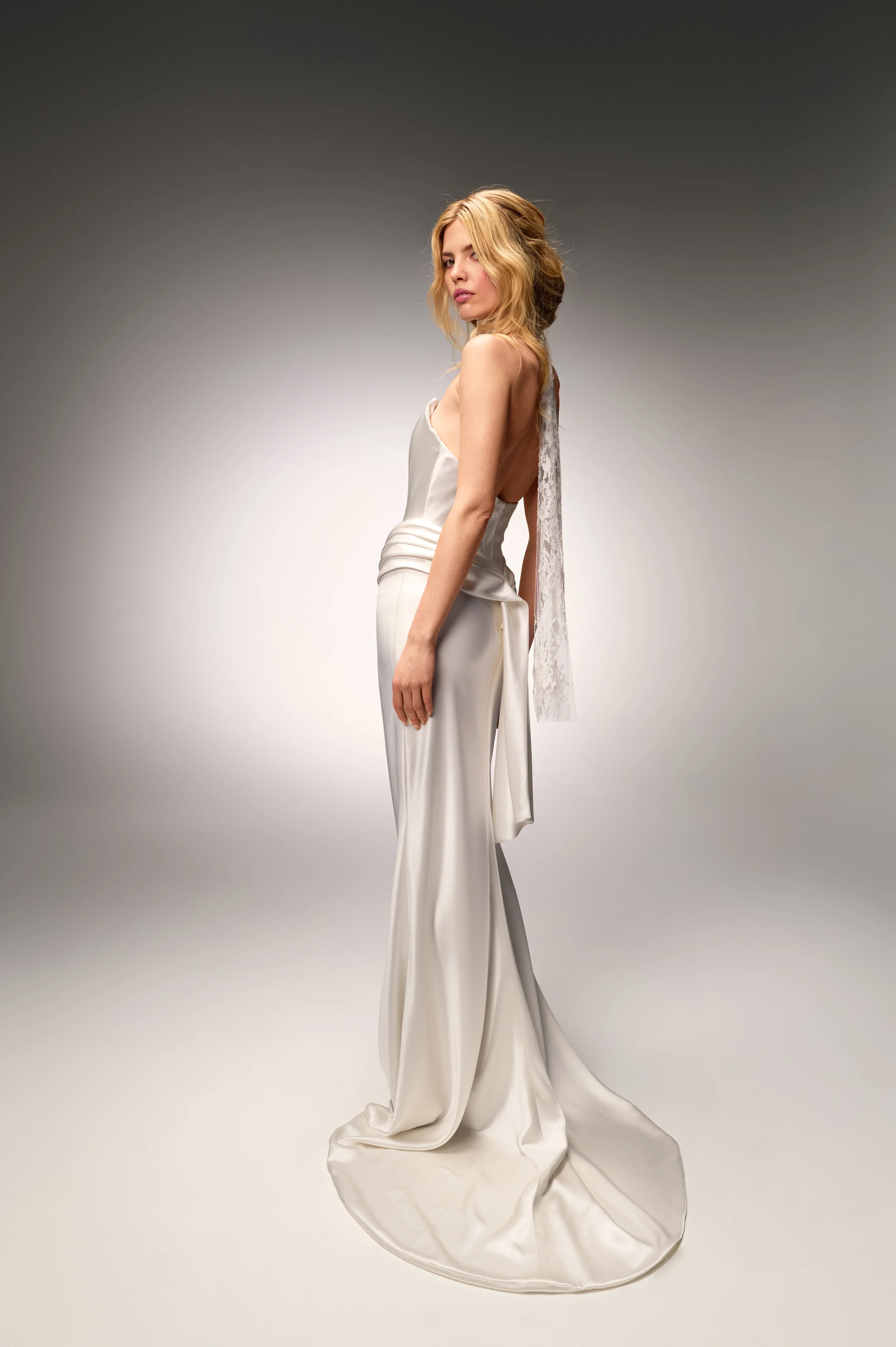 Back view of the Deneuve gown displaying the elegant silhouette and train