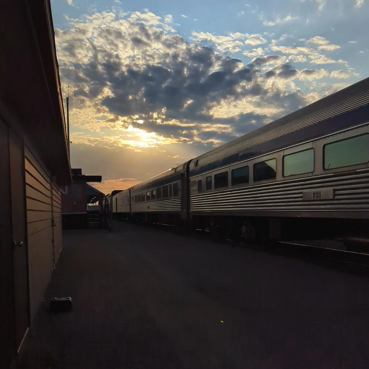 train at station at sunset