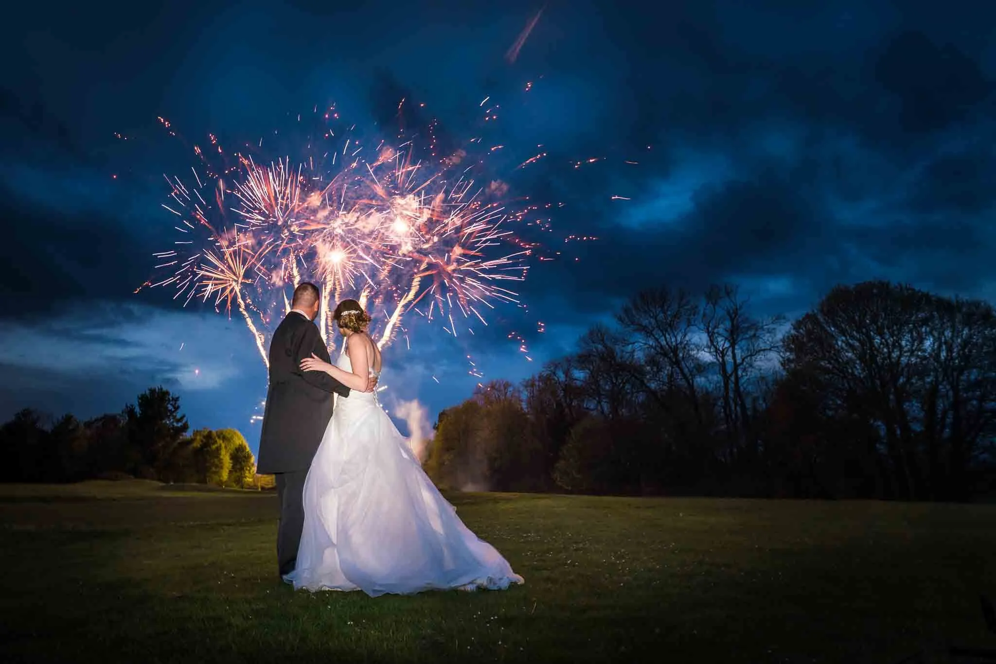 Wiltshire Wedding Photographer, Bride and Groom with fireworks