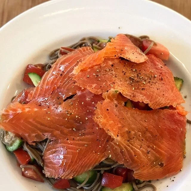 Some incredibly delicious Cold Smoked Steelhead on a simple Soba Noodle, Cuke and Tomato Salad, lightly tossed with lemon juice and tamari #youarewhatyoueat #bekind @newyorksteelheadhv