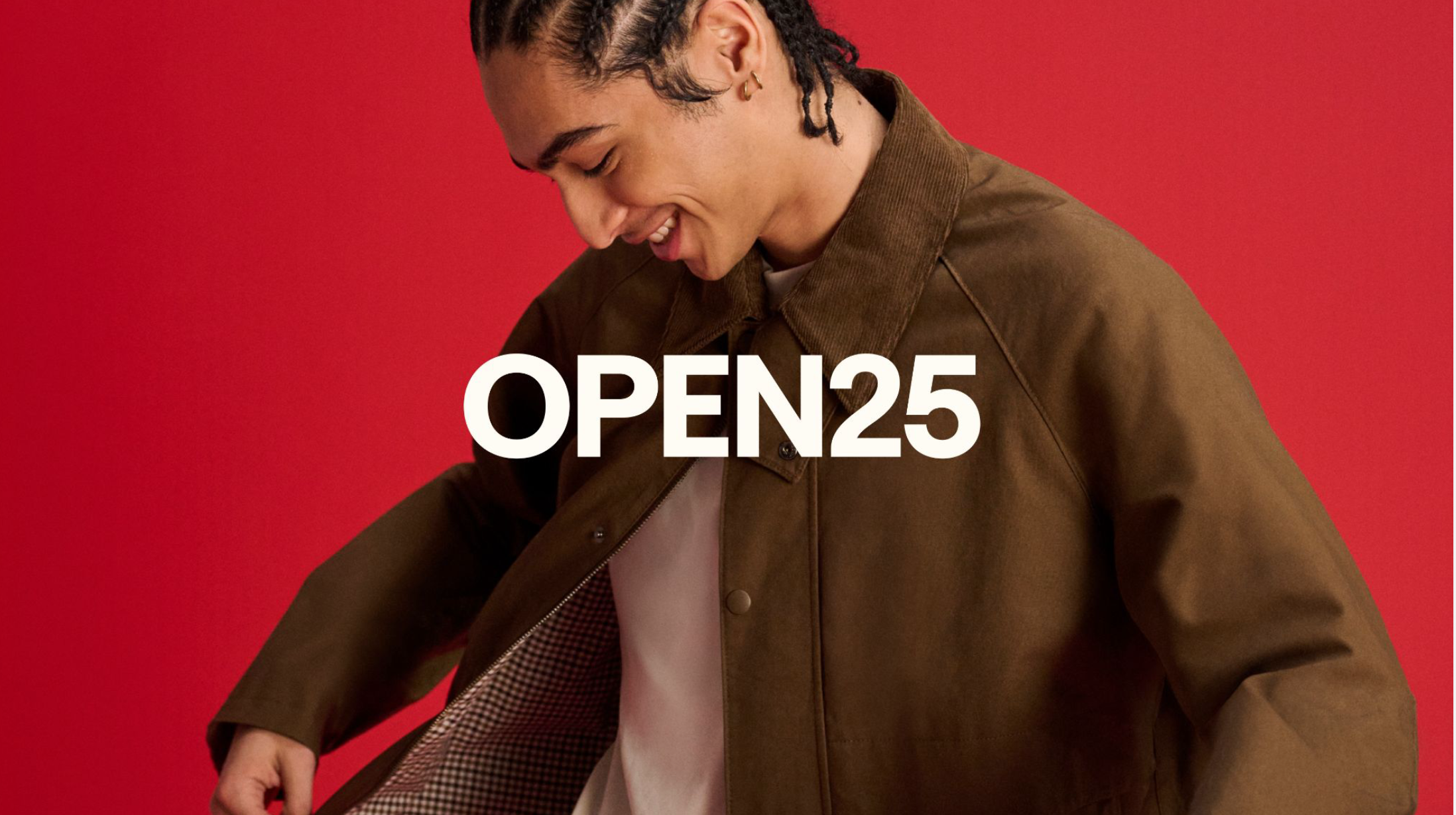 eBay OPEN25 image of man smiling opening his coat