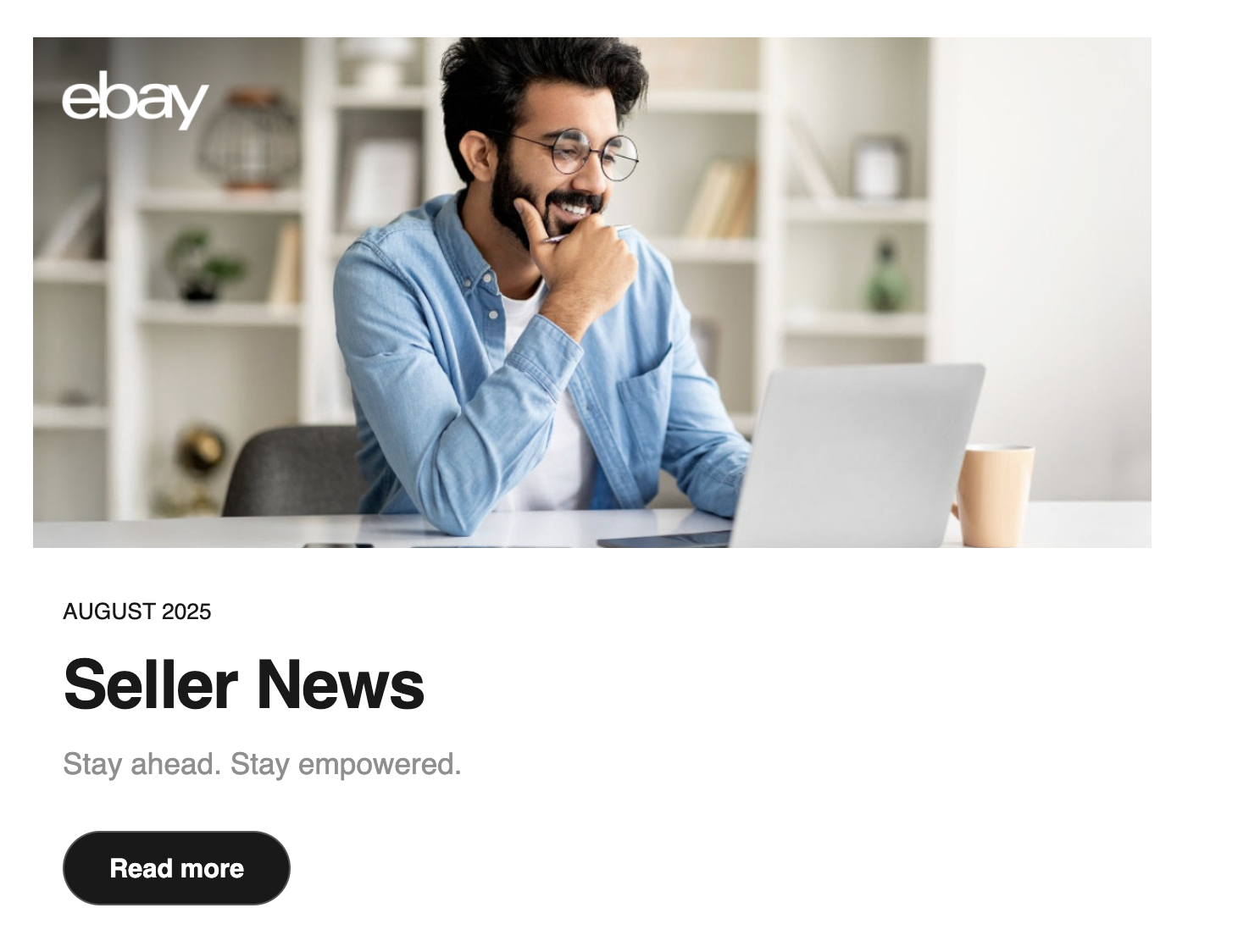 eBay image of man smiling looking at laptop