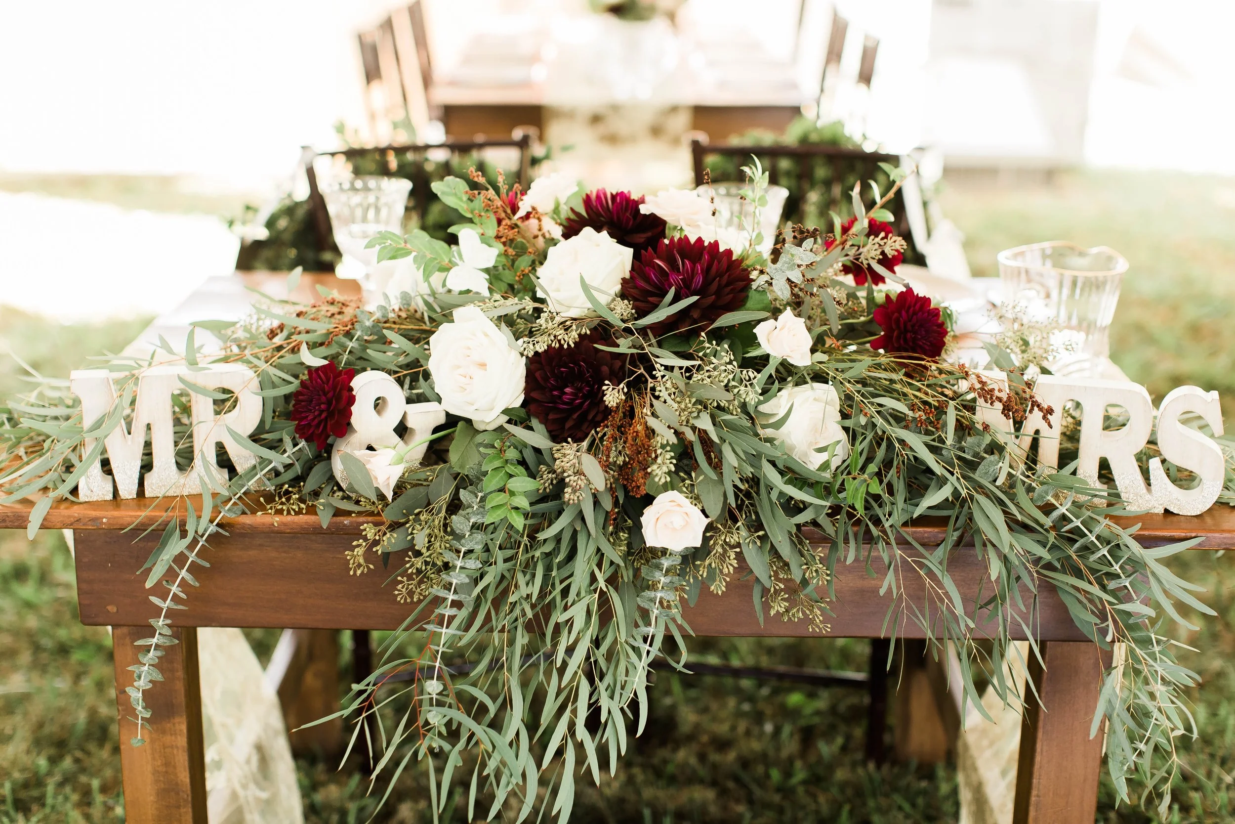 ivory and darkest red centerpieces.jpg