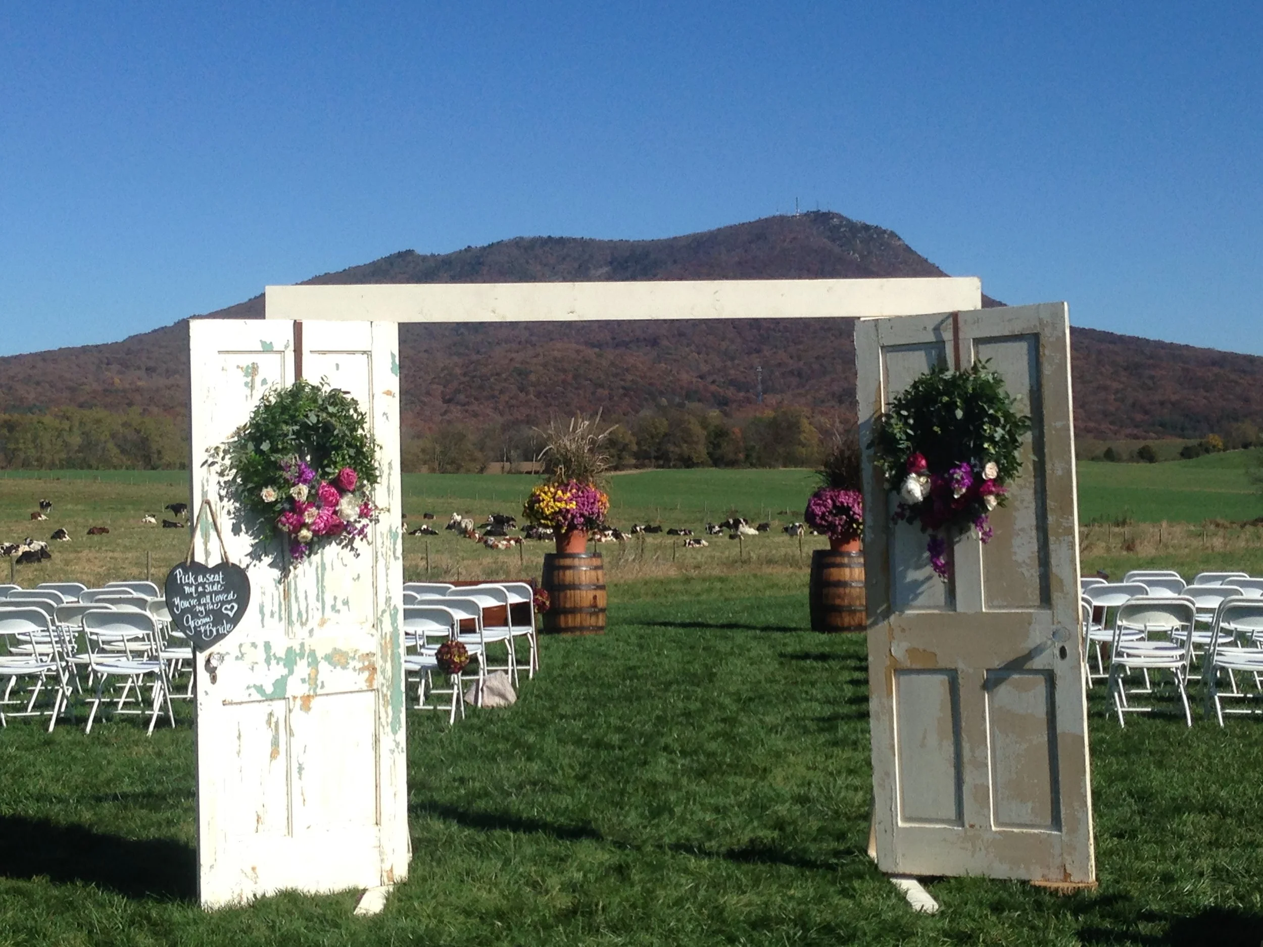 ceremony doors with wreaths.jpeg