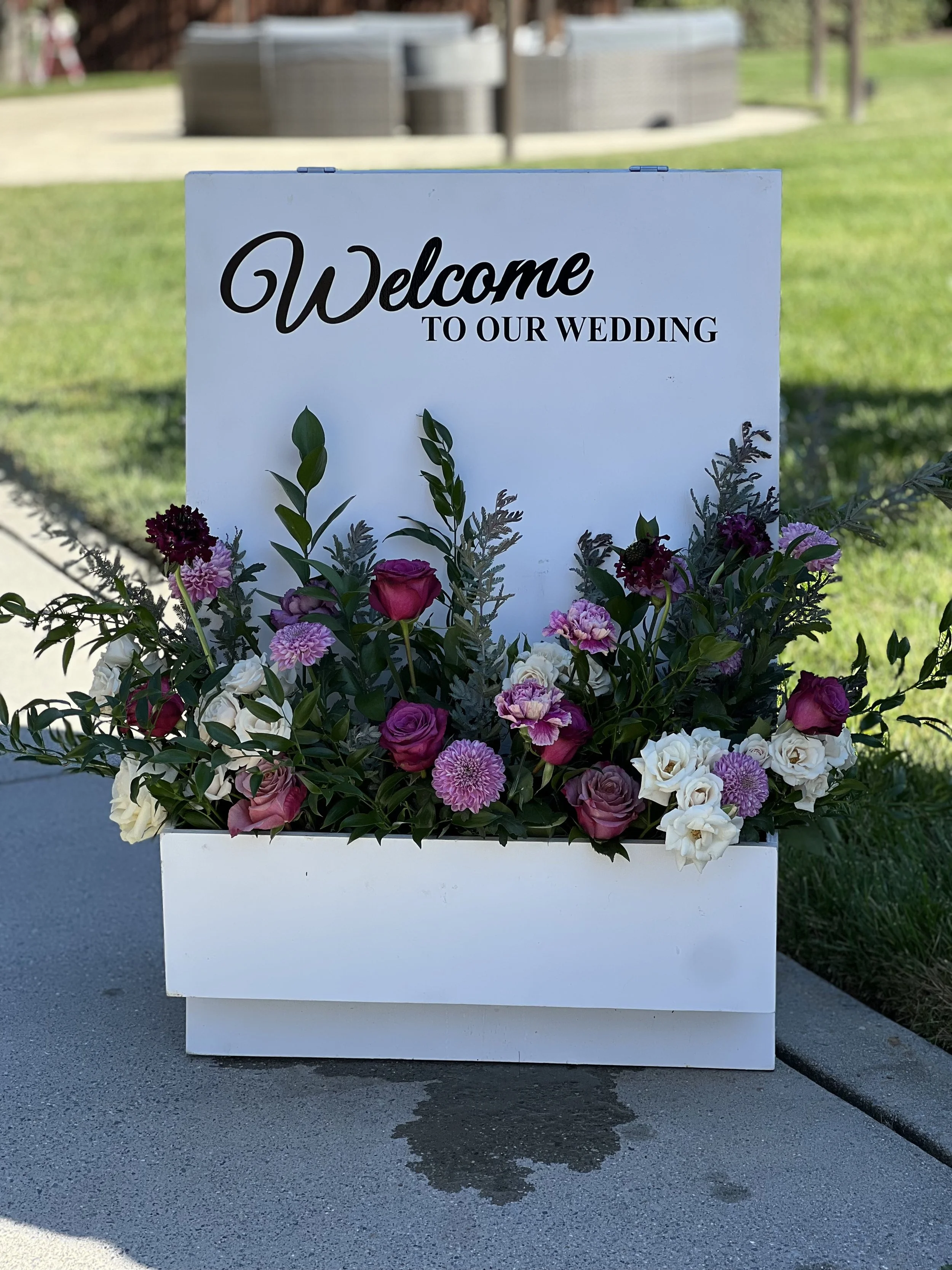 purple welcome sign florals.jpeg