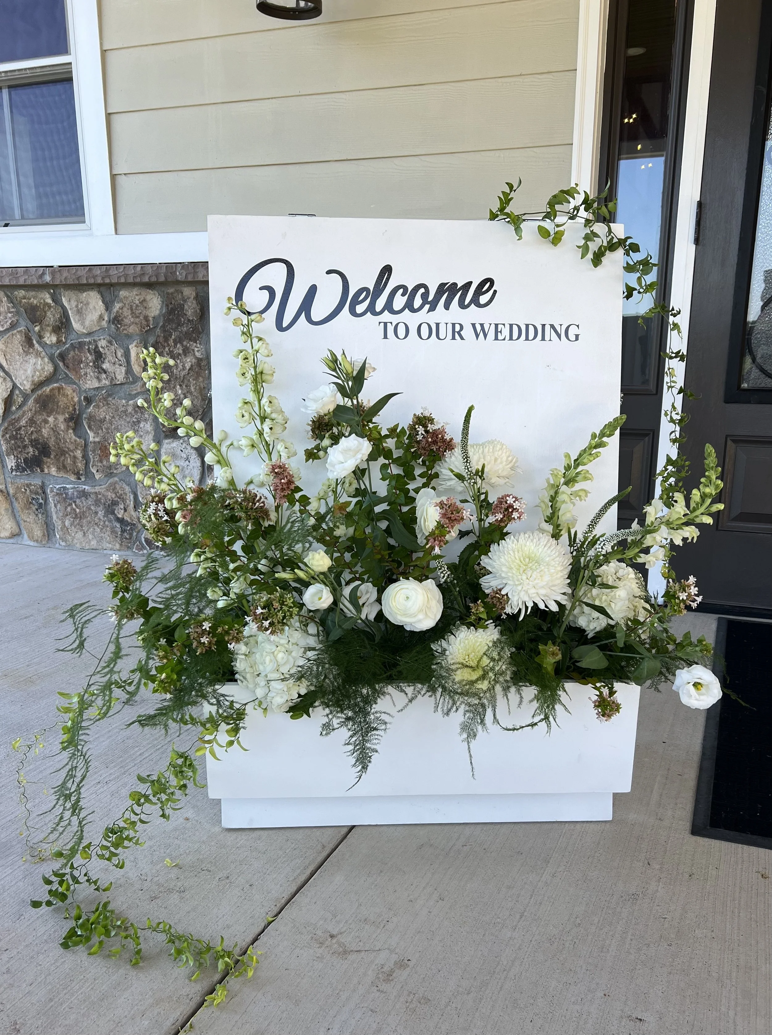 luxe welcome sign florals.jpeg