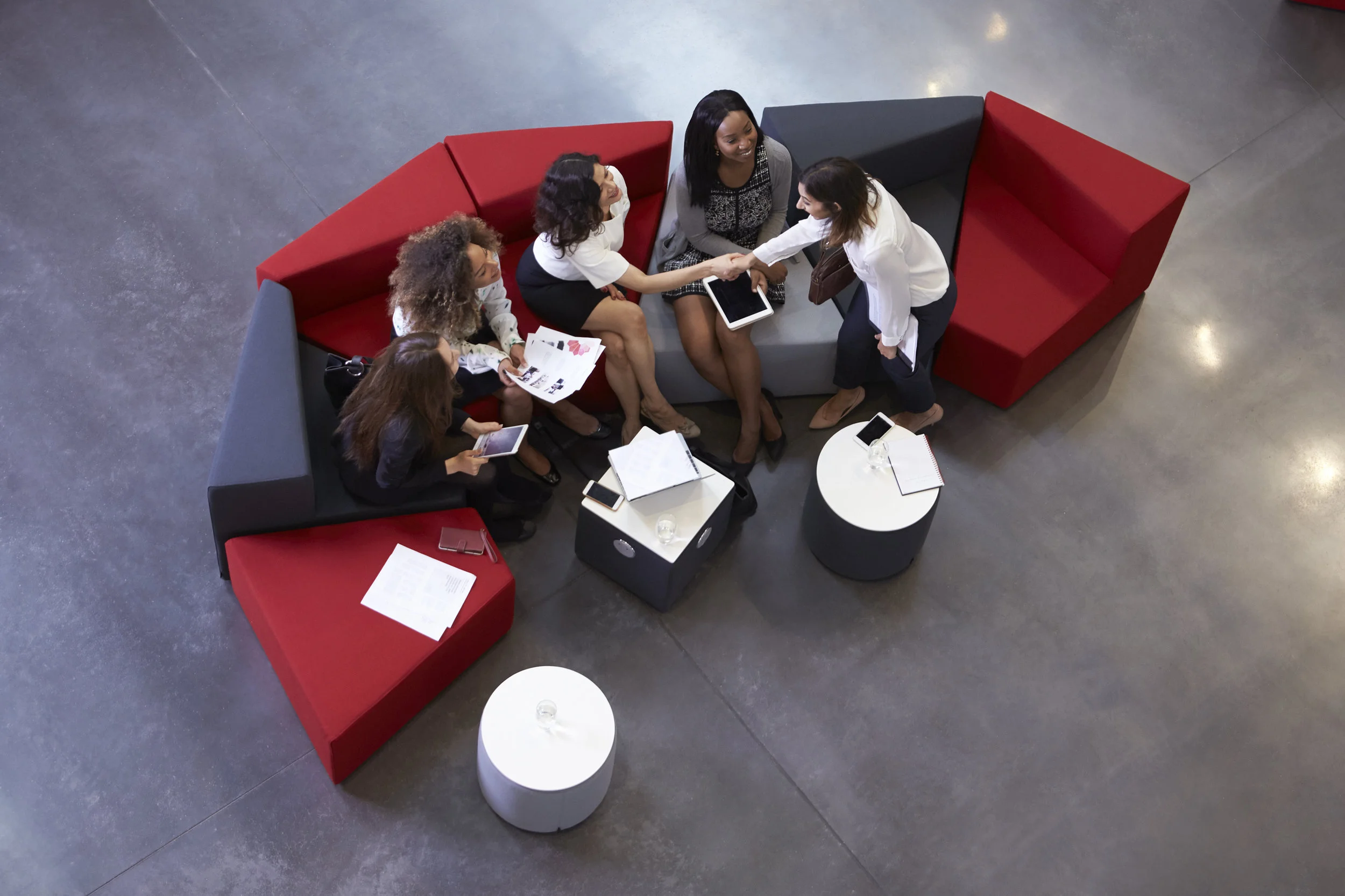 overhead-shot-of-businesswomen-meeting-in-lobby-PPMLTHJ.jpg