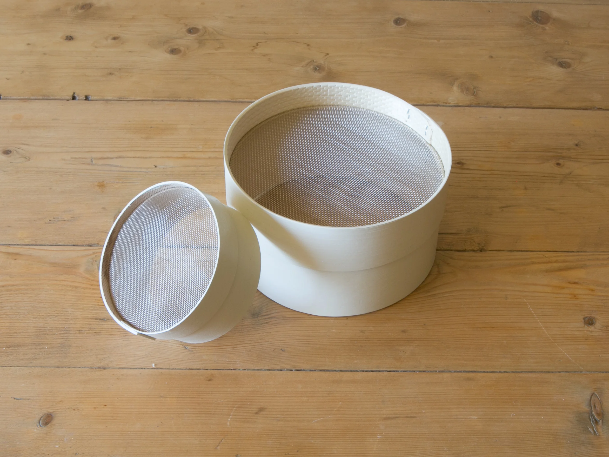 white painted sieve