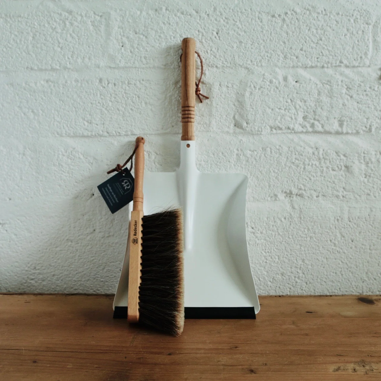 white metal dustpan and brush set
