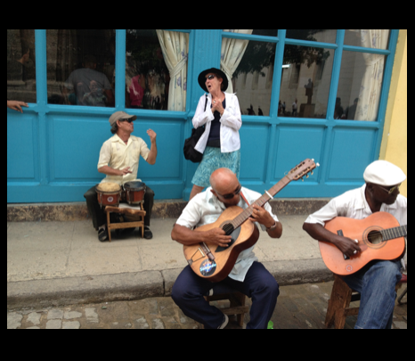 Sheila Singing with Havana Street Band, two men with guitars and one with drums