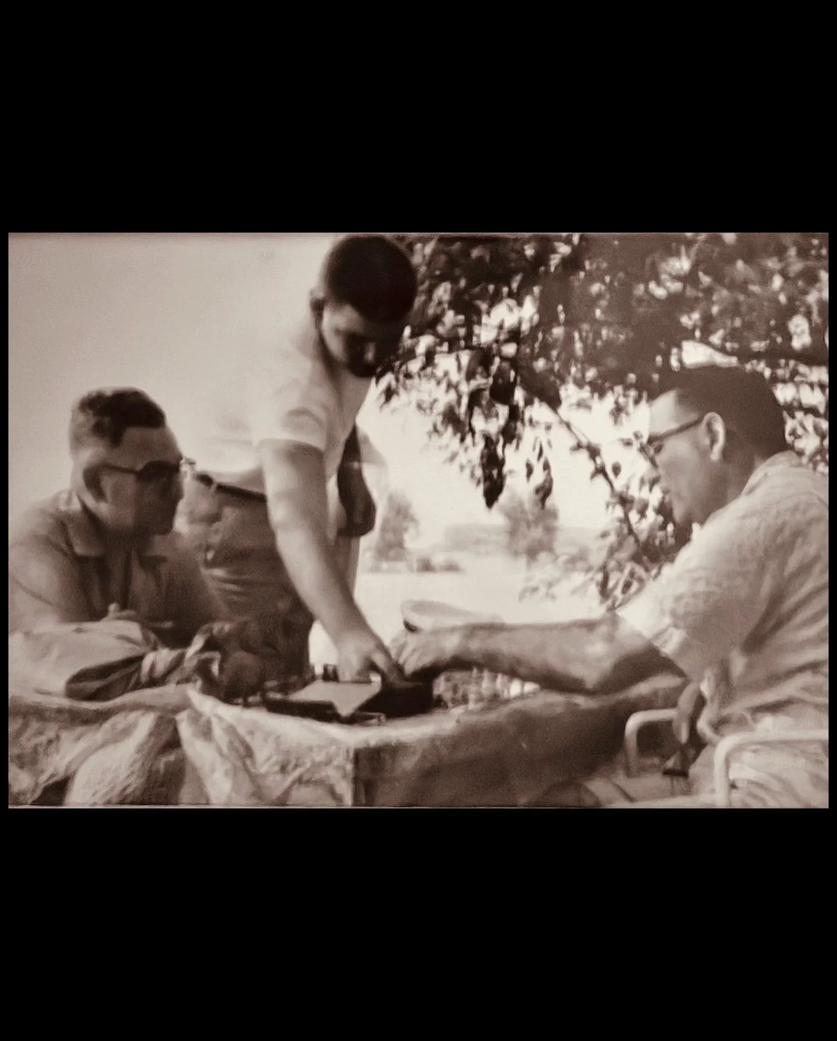 Uncle Zuce, my brother, Dad playing chess