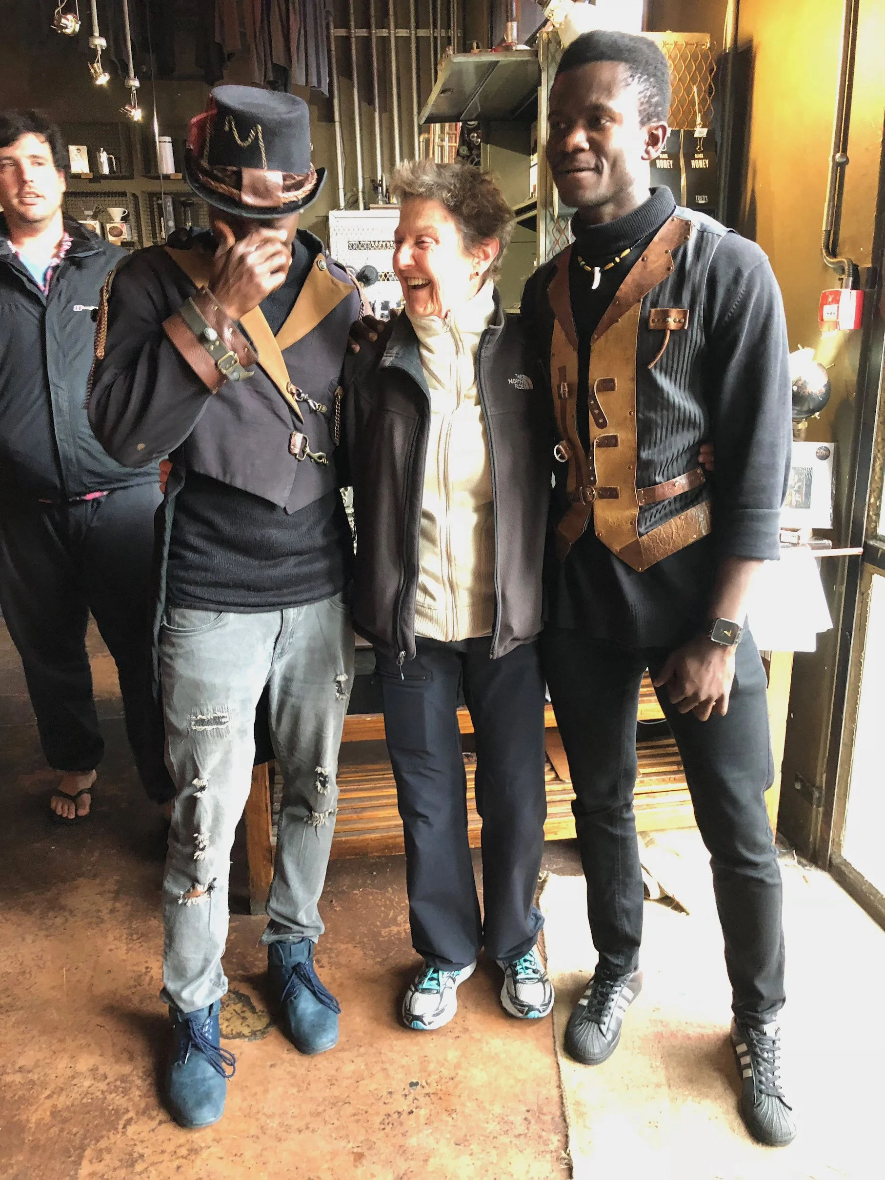 Sheila standing with two men dressed in Steam Punk outfits.