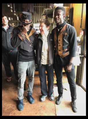Sheila standing with two men dressed in Steam Punk outfits.
