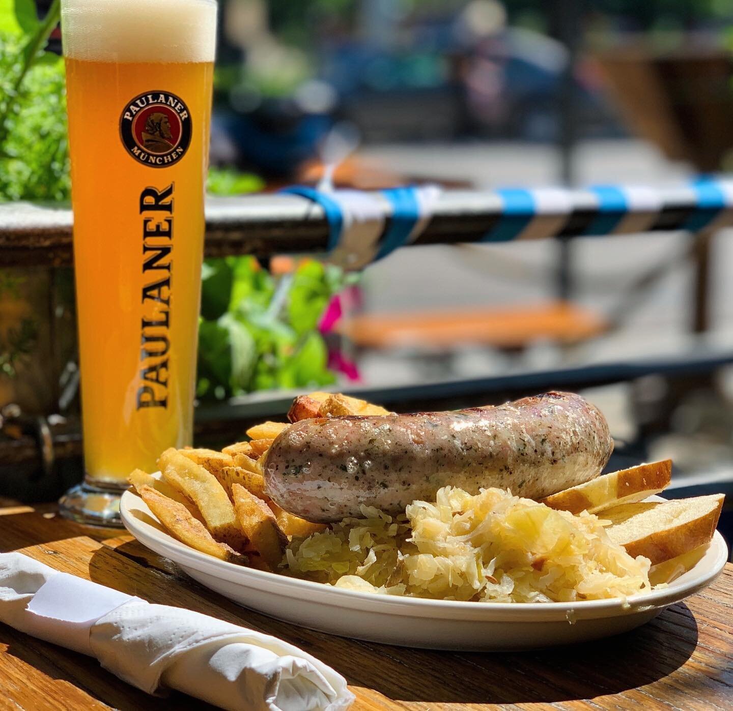 Soak up these last moments of patio weather with some sausage and beer. #patio #coloradosun #bier