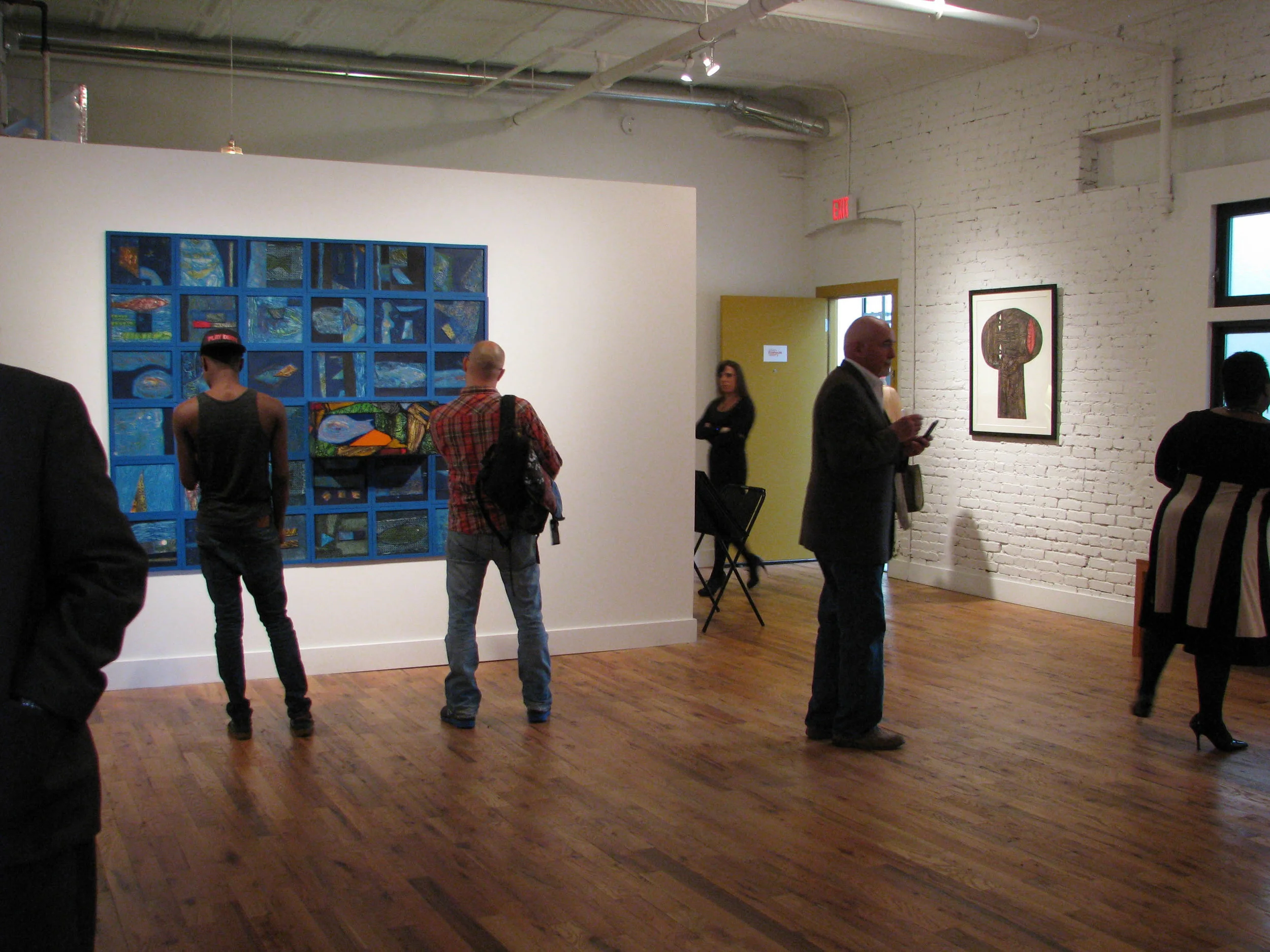  Gallery visitors at  Choco: Retazos del Sol (Traces of the Sun)  exhibition 