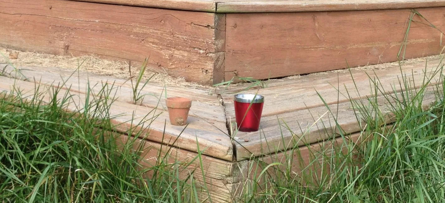 Here is the shot cup and the pot next to each other on the corner of the deck where I leave it.