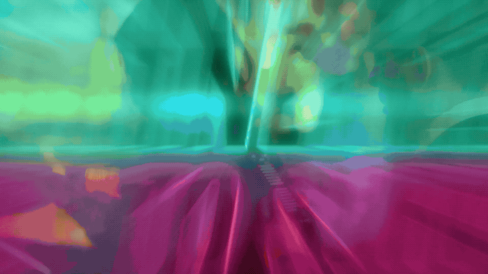 Blurred colorful image with streaks of pink, green, and blue.