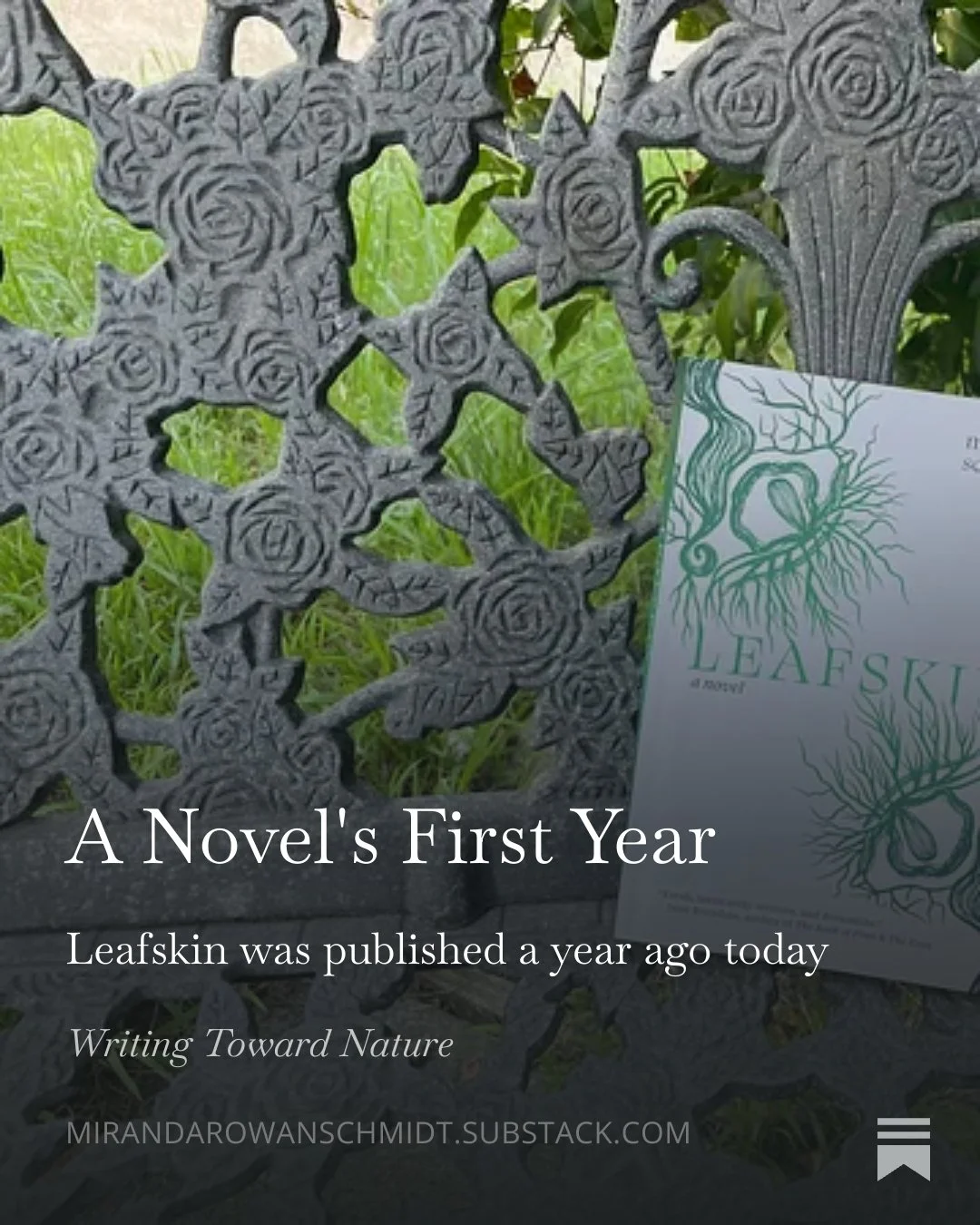 Photograph of the book Leafskin on a bench with metal rose design and the text "A Novel's First Year, Leafskin was published a year ago today"
