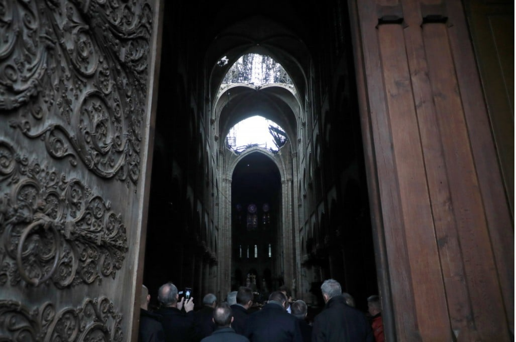 Interior with holes in roof (photo credit Christophe Petit Tesson/AP)