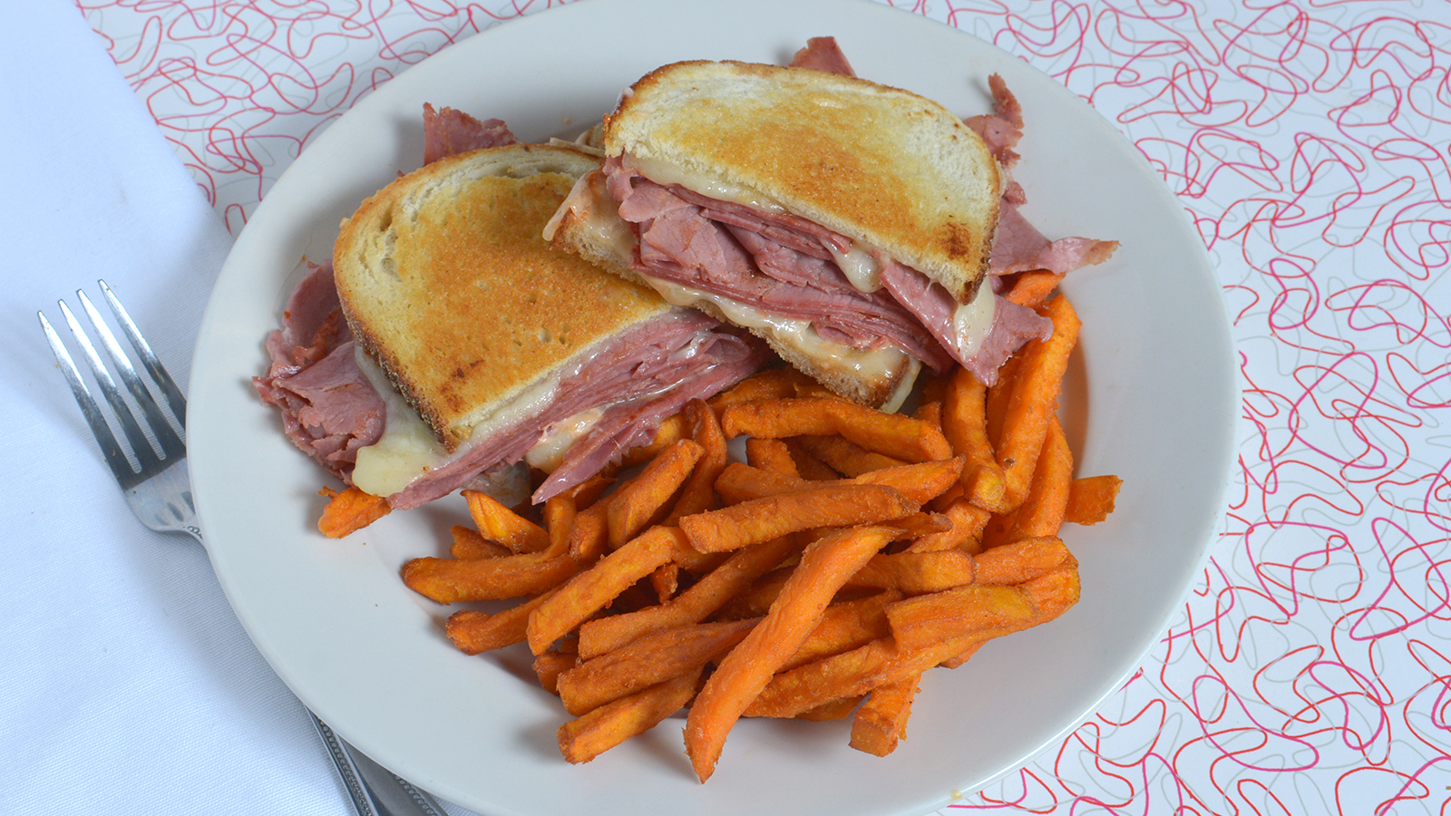 Happy Times Cafe Reuban with Sweet Potatoes Fries.jpg