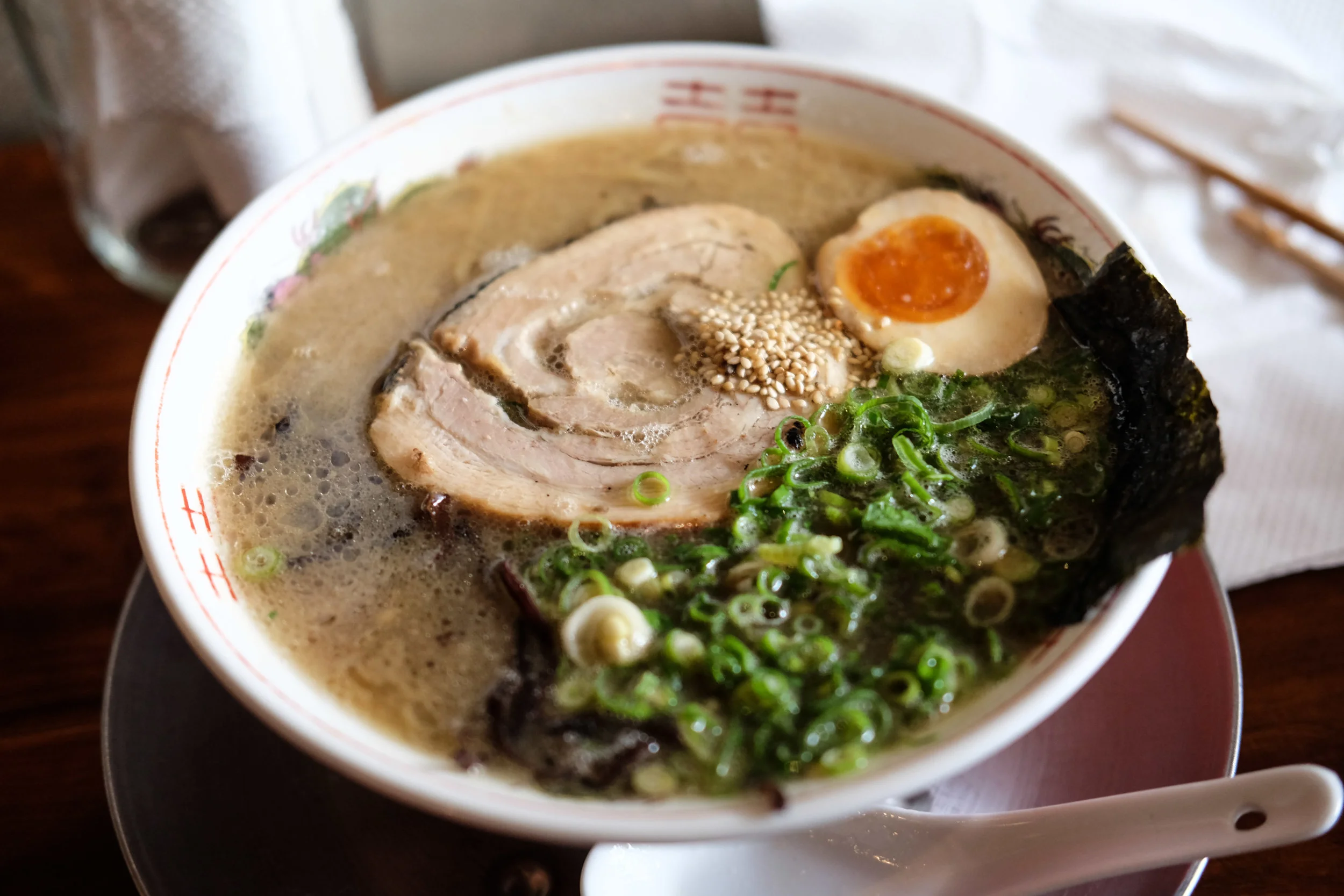Chaco Bar (10 min walk) What Chaco Bar lacks in size, it more than makes up for in style. This dimly lit Yakitori and Ramen bar is as unpretentious as it is uncomplicated, with a simple menu offering Ramen at lunch, and Yakitori at night (although you can guess the only thing on the menu on “Ramen Monday’s”). Order the Fat Soy Ramen for umami-laden broth, tender pork belly and perfectly soft Ramen egg and the Karaage Chicken side for perfectly deep fried chicken pieces that are meltingly tender, full of flavour and impressively un-oily. 