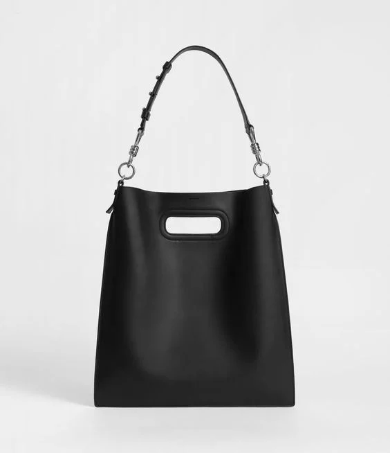 Right now on the Edgy page : All Saints Captain Leather Flat Hobo Bag. $298.