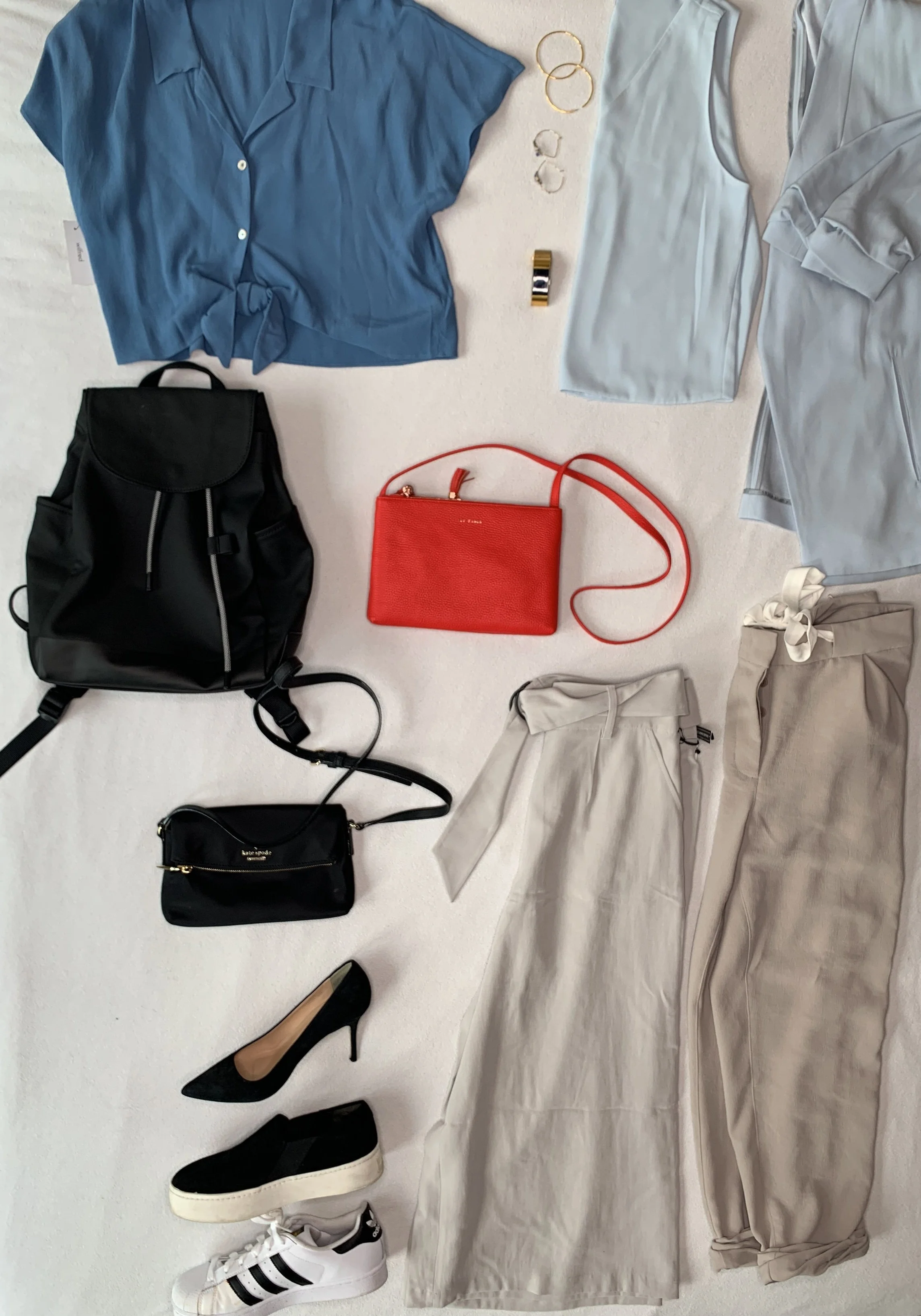 One of my client, Natasha’s, outfit photos illustrating how she can pair her long line blazer with either blue crop top and two pairs of pants. Everything on this photo works with everything else, making packing for weekend trips or figuring out what to wear each day easy. Her blazer is also the same blazer shown in the product shot below. Her photo shoot is coming up soon!