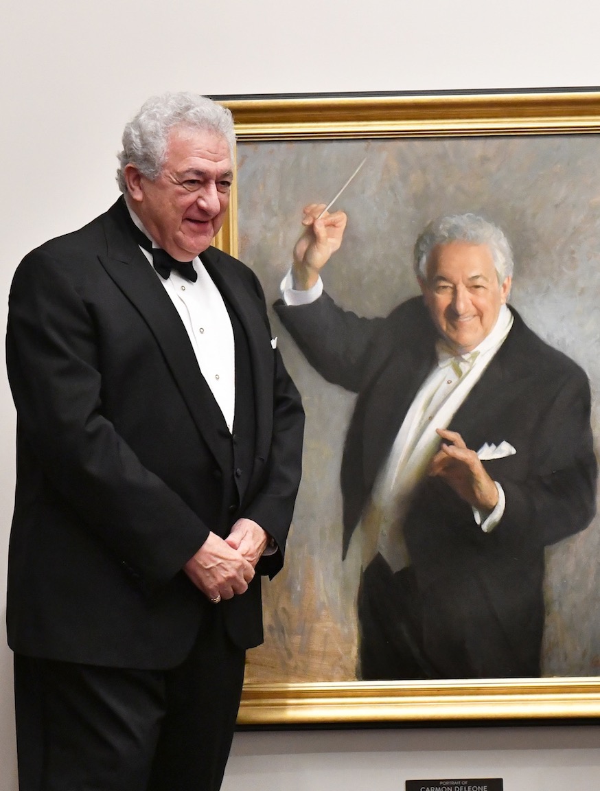 Maestro Carmon DeLeone with Portrait of Carmon DeLeone , 40” x 30”, oil on linen canvas, Music Hall collection. Photo by Steven Thomas.
