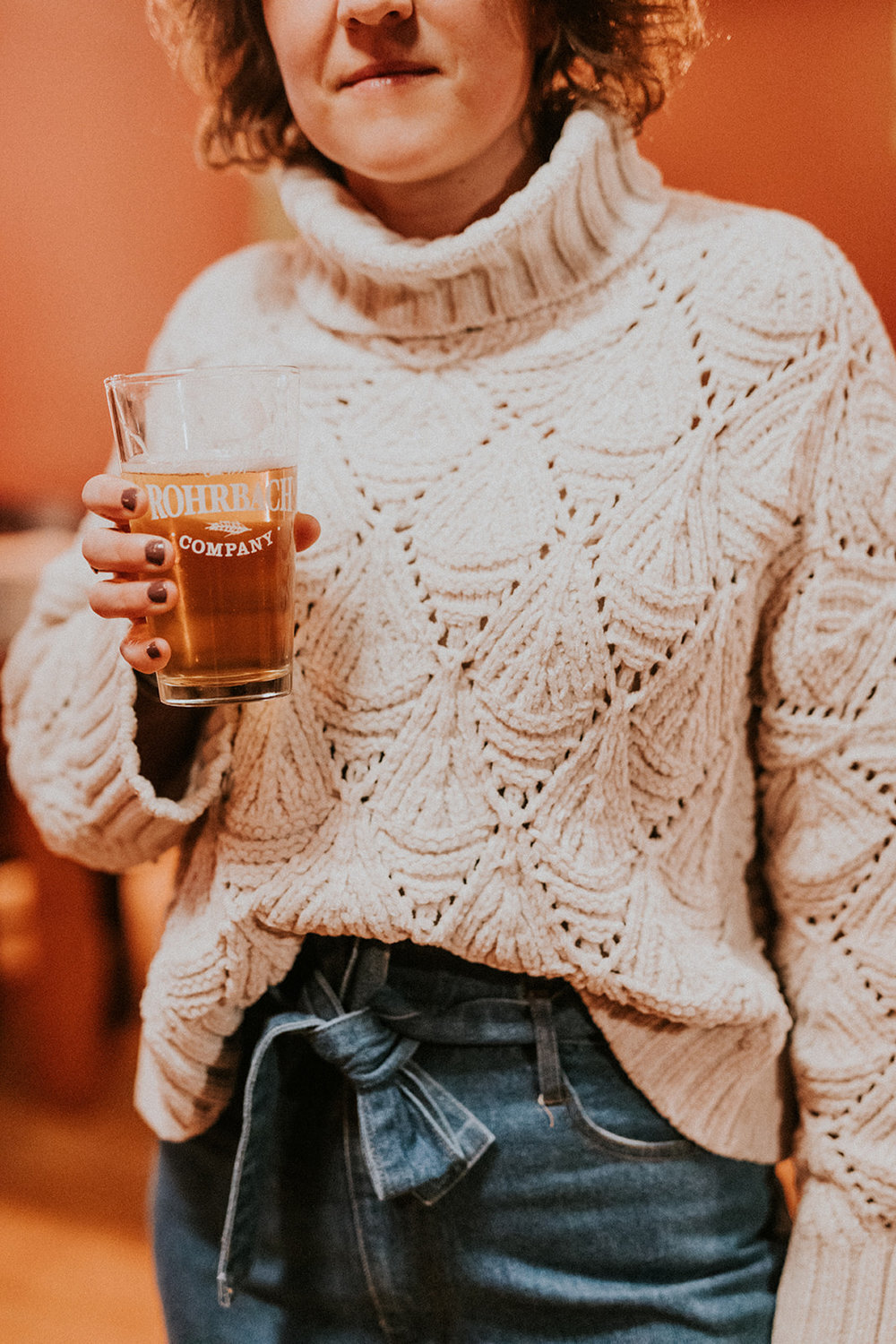 Woman holding Rohrbach beer