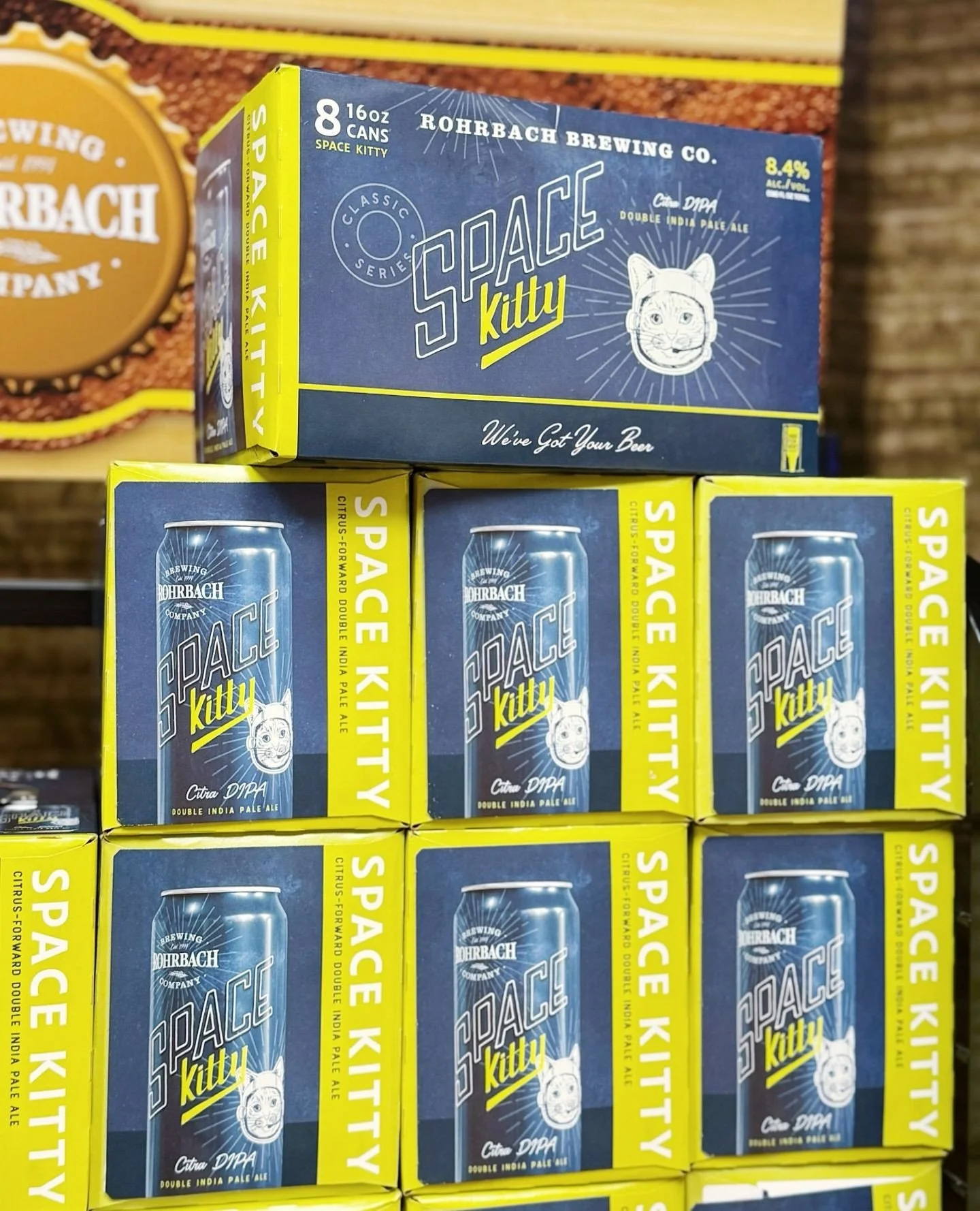 Space Kitty is ready for kickoff. 🏈⁠
⁠
A crowd-favorite citrus-forward brew that's bold enough to keep all afternoon. Stack a few 8-packs now so halftime decisions stay easy.⁠
⁠
We&rsquo;ve got your beer. Literally.⁠
⁠
#biggamebeer #drinklocal #spac