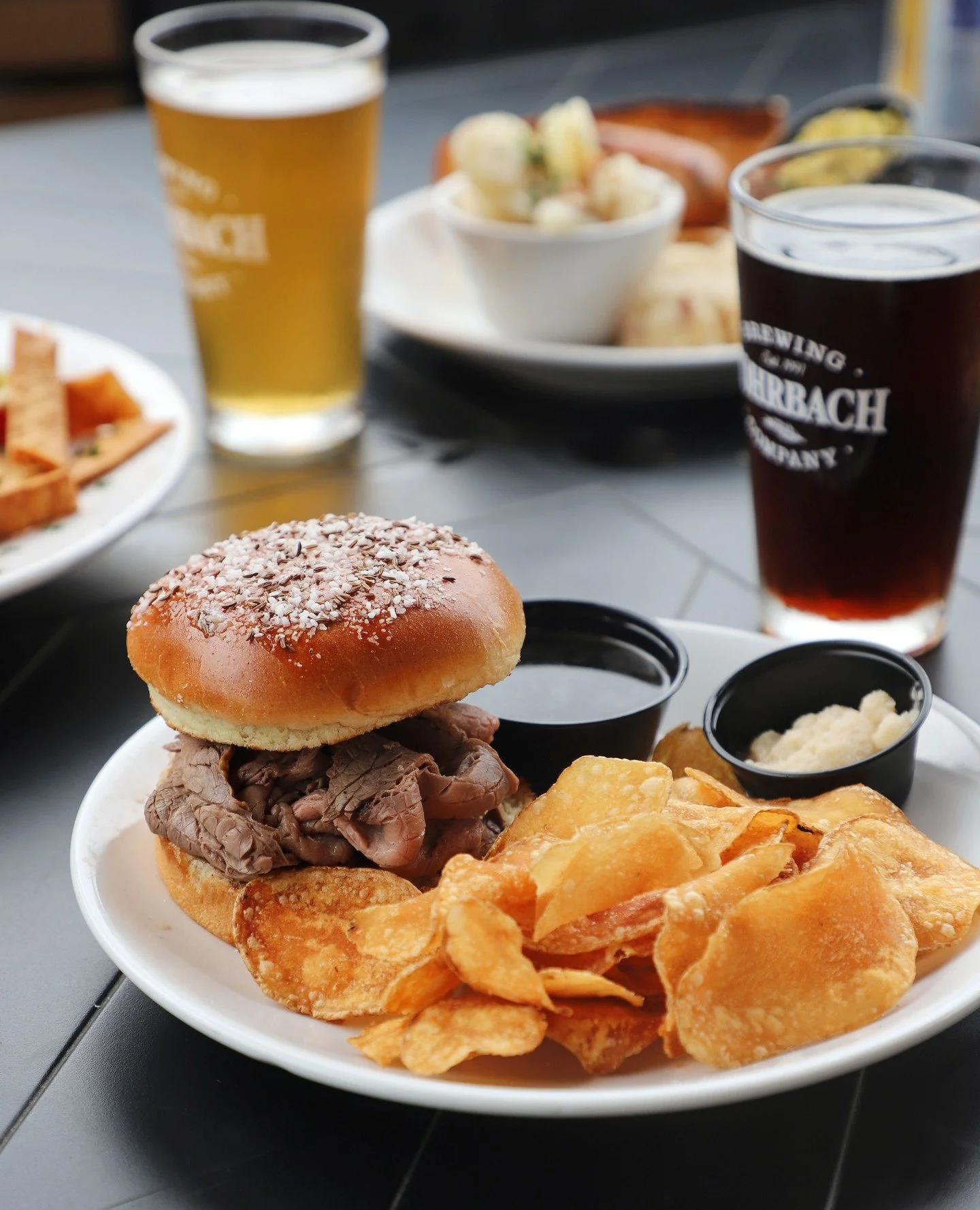 Weck yeah. 🍔⁠
⁠
Catch this one at the Buffalo Rd. Brewpub &rarr; Slow-roasted beef stacked on a kimmelweck with au jus and horseradish. Add Swiss, peppers, and onions if you want to go all the way.