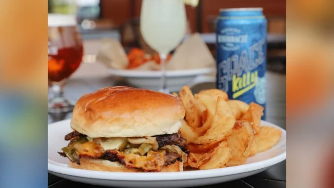 Burger and chips at Rohrbach Brewing Co with a can of Space Kitty in the background